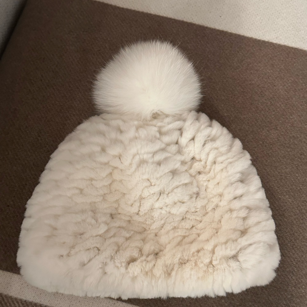 White fuzzy cap with pom pom